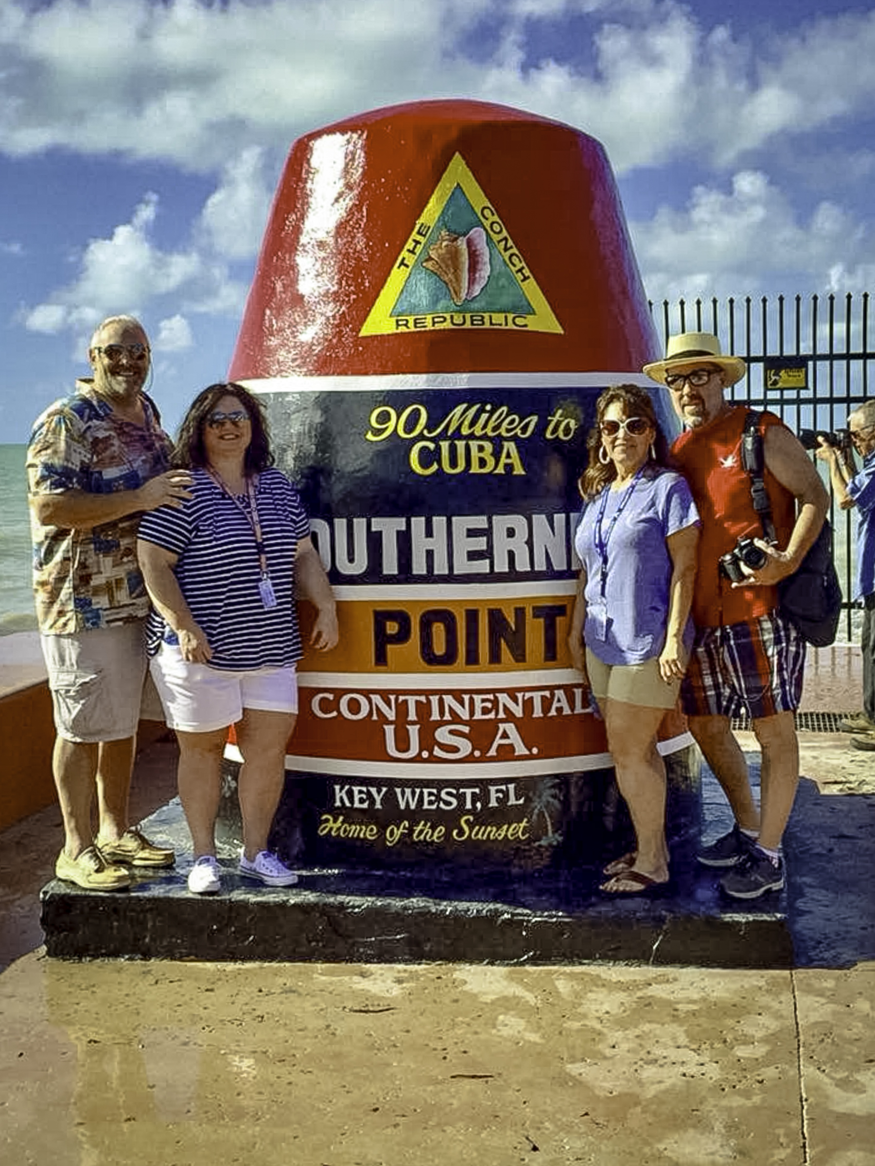 Tim, Melissa, Greg, and Mitzi at the Southernmost Point marker in Key West