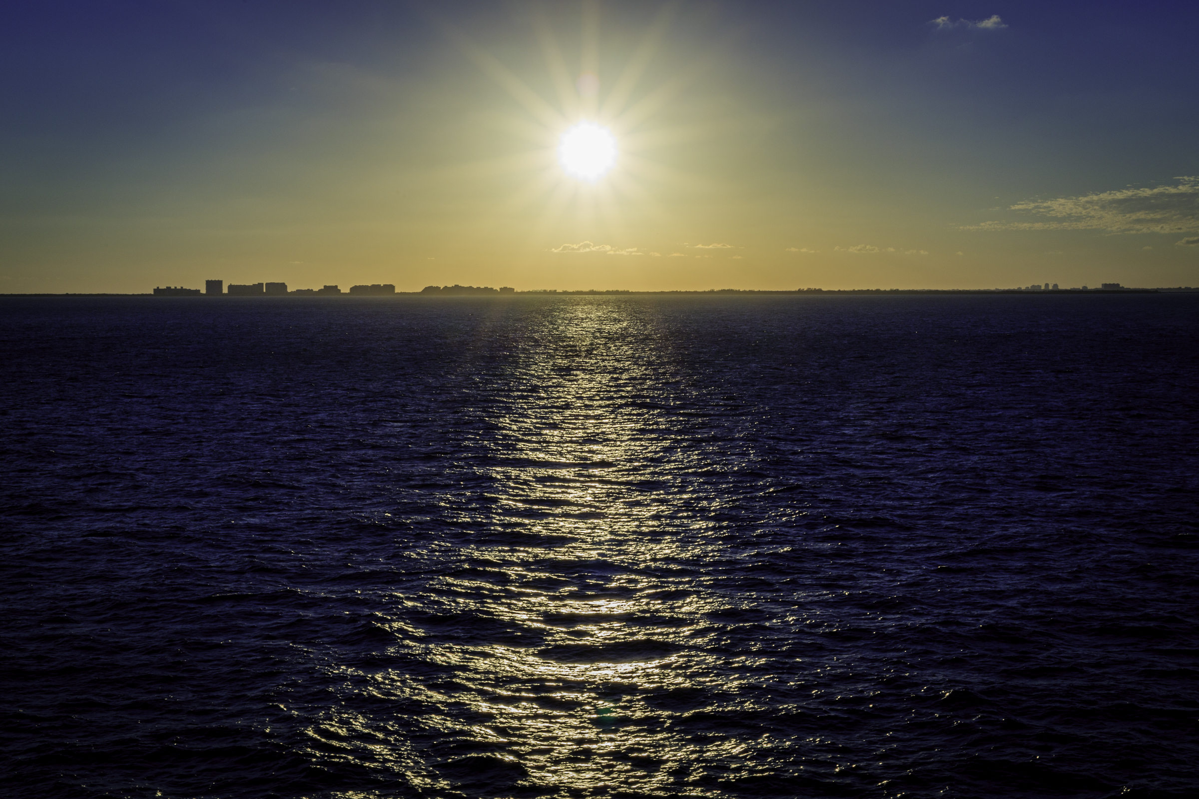 The sun reflecting across the ocean during the cruise toward Cuba